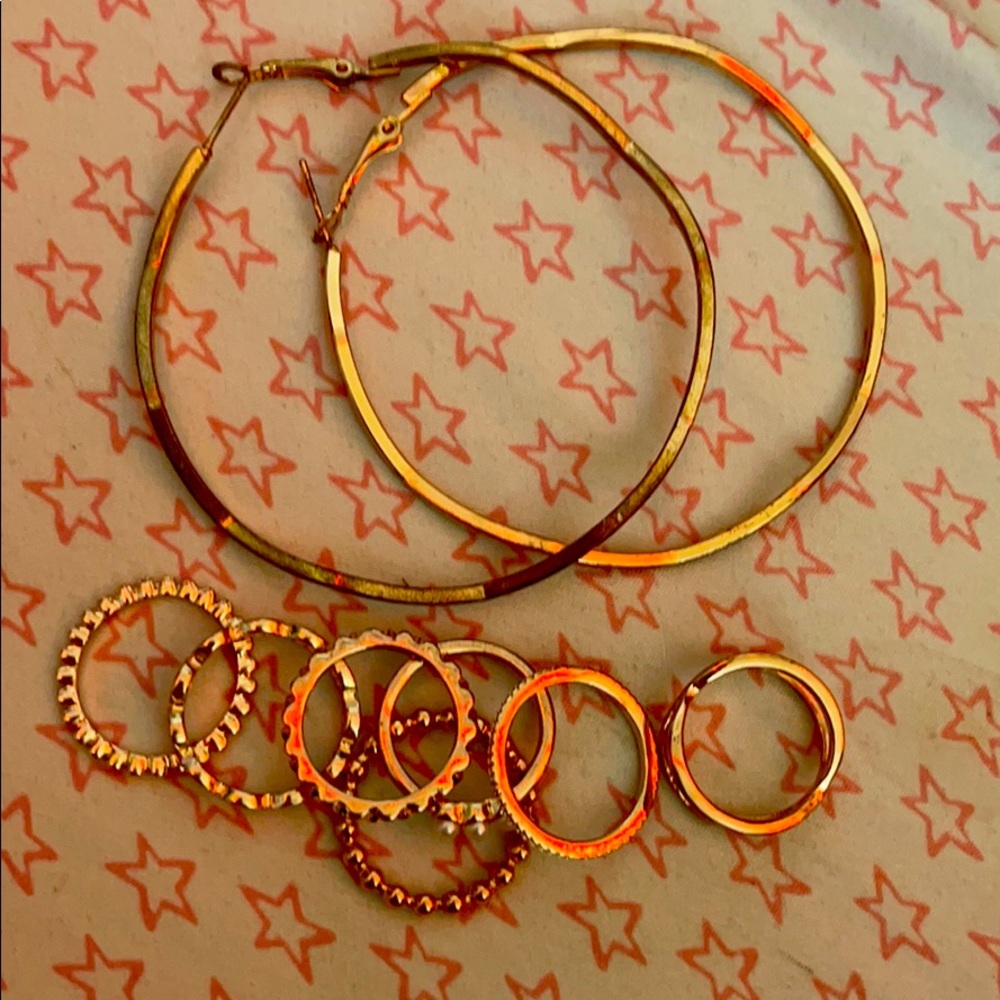 One pair of brand new earrings and 7 rings